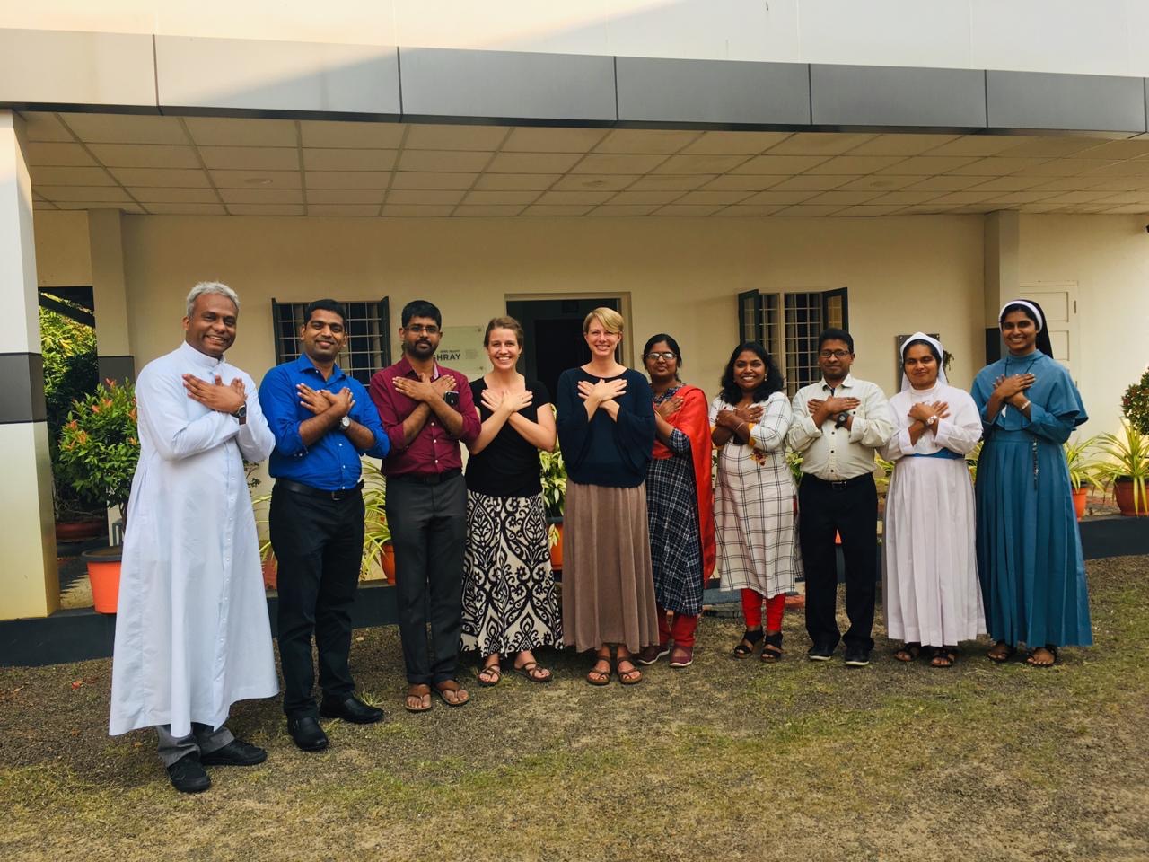 Kelly Smyth-Dent, LCSW, leading a private Acute Stress Syndrome Stabilization (ASSYST) group training with mental health professionals and clergy practicing a grounding technique.